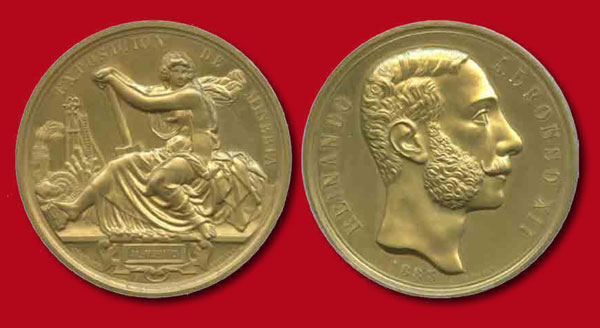 Imagen de la Medalla de Oro por ambas lados obtenida por el MNCN en la Exposición Nacional de Minería